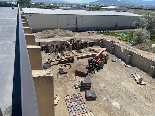 The construction site viewed from above showing the foundation being laid out.