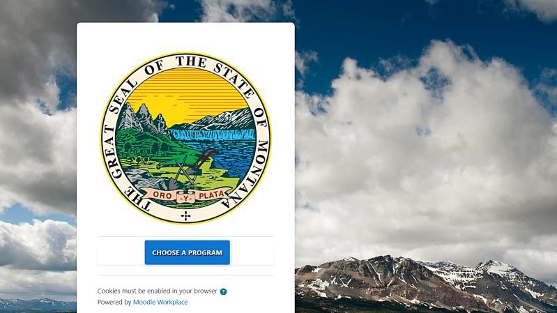 Montana Moodle homepage showing the Great Seal of the State of Montana with a red arrow pointing to the blue 'Choose a Program' button. Text at the bottom reads: Cookies must be enabled in your browser. Powered by Moodle Workplace.