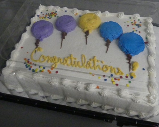 Picture of a frosted cake that says 'Congratulation'